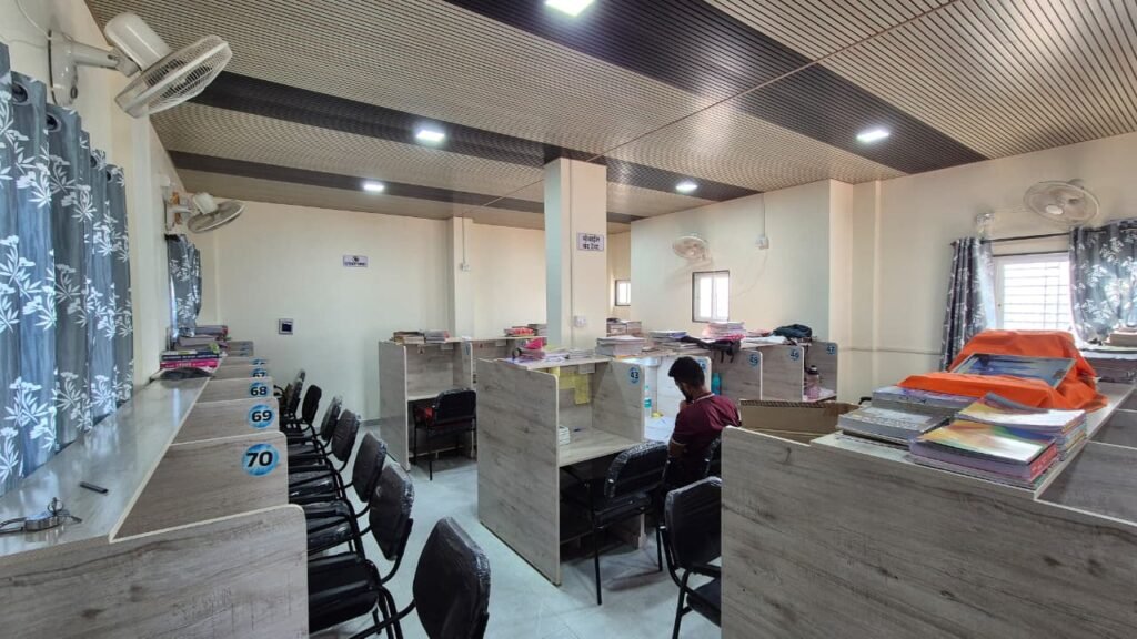Spacious study room with individual desks in Satara